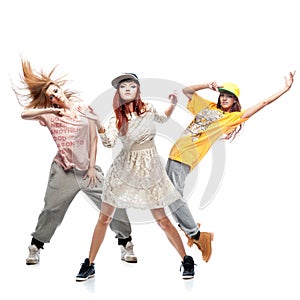 Group of young femanle hip hop dancers on white background