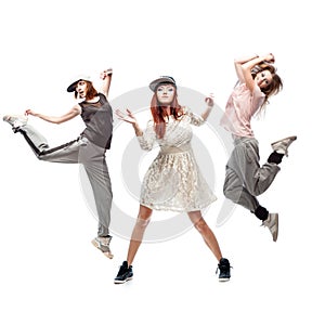 Group of young femanle hip hop dancers on white background