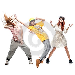 Group of young femanle hip hop dancers on white background