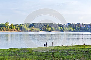 A group of young fishermen fishing in the Gulf of Berdsk