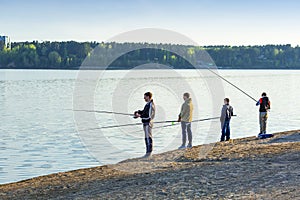 A group of young fishermen fishing in the Gulf of Berdsk