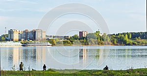 A group of young fishermen fishing in the Gulf of Berdsk