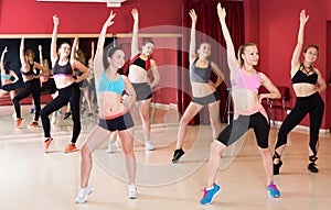 Group of young fitness women dancing zumba