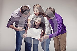 Group of young friends with advert board