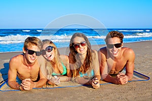 Group of young friends couples portrait in beach