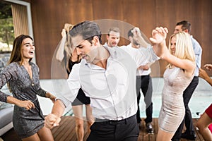 Group of young friends dancing