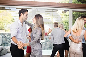 Group of young friends dancing