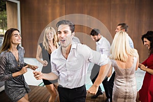 Group of young friends dancing