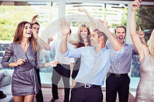 Group of young friends dancing