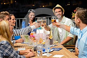 Group of young friends drinking beer outdoors