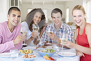 Group Of Young Friends Enjoying Meal Together