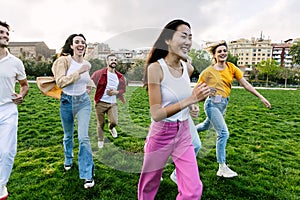 Group of young friends having fun together outdoors.