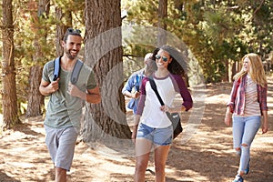 Group Of Young Friends On Hiking Adventure In Countryside