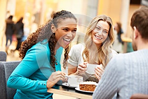 Group Of Young Friends Meeting In Cafe