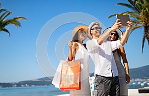 Group of young friends people doing selfie after shopping