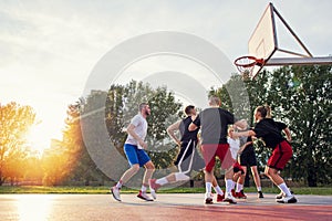 Group Of Young Friends Playing Basketball Match