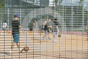 Group of young friends playing sports games on playground, summer, selective focus. Outdoor sport, Blurred background