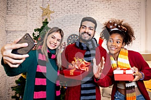 Group young friends taking selfie with excited and enjoy with smart phone together at home.