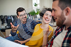 A group of young friends talking indoors at home, house sharing concept.