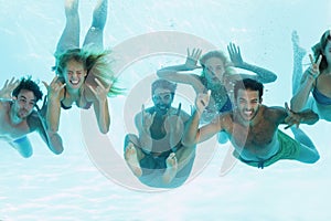 Group of young friends underwater