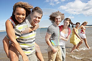 Group Of Young Friends Walking Along