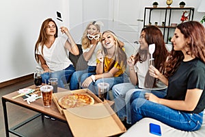 Group of young friends woman having party with costume accessories at home