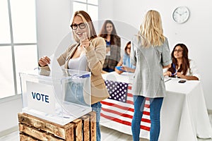 Group of young girls voting at democracy referendum pointing fingers to camera with happy and funny face