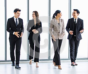 Group of young happy Asian male and female professional successful businessman and businesswoman colleagues partnership teamwork