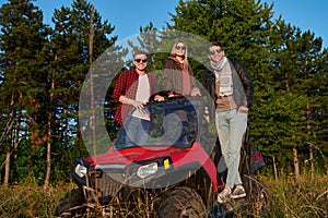 group young happy people enjoying beautiful sunny day while driving a off road buggy car