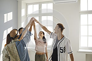 Group of young hip hop dancers raises their team spirit in preparation for dance competitions.