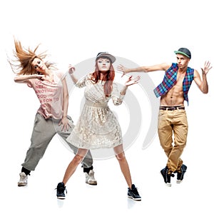 Group of young hip hop dancers on white background