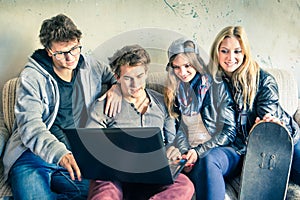 Group of young hipster best friends with computer