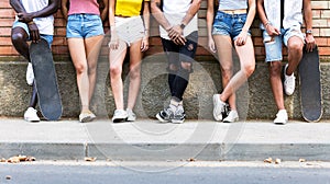 Group of young hipster friends posing in an urban area.