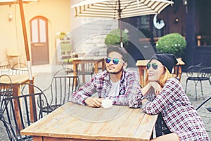 Group of young hipster sitting in a cafe,Young cheerful friends having fun while take time together, Holiday freedom enjoy