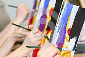 A group of Young individuals enjoying paint n sip activities outdoor photo