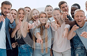 Group of young like-minded people pointing at you