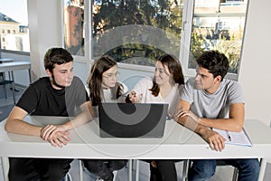 Group of young male and female teenager university students at school sitting on classroom learning and working on project togethe