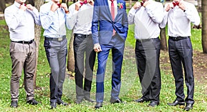 Group of young men with bow tie. Cheerful friends. friends outdoors. Wedding day.