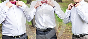 Group of young men with bow tie. Cheerful friends. friends outdoors. Wedding day.