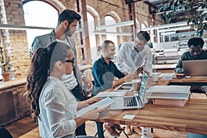 Group of young modern people in smart casual wear