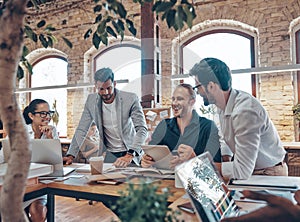 Group of young modern people in smart casual wear