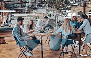 Group of young modern people in smart casual wear