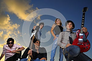 Group of young musicians posing with instruments