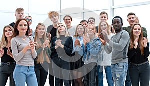 Group of young people applauding . photo with copy space.