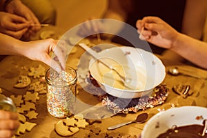 Group of young people baking cookies for christmas