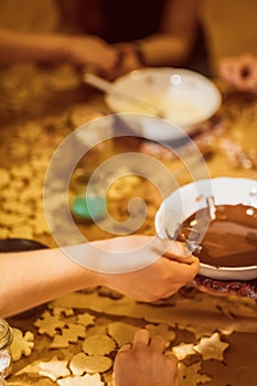 Group of young people baking cookies for christmas