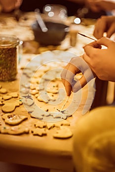 Group of young people baking cookies for christmas