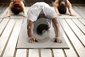 Group of young people in Balasana exercise photo