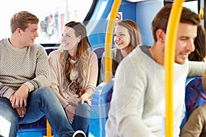 Group Of Young People On Bus Journey Together