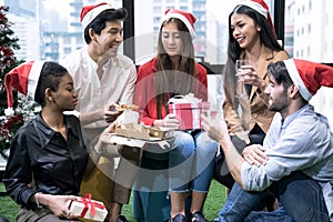 Group of young people celebrating the new year together at the office.